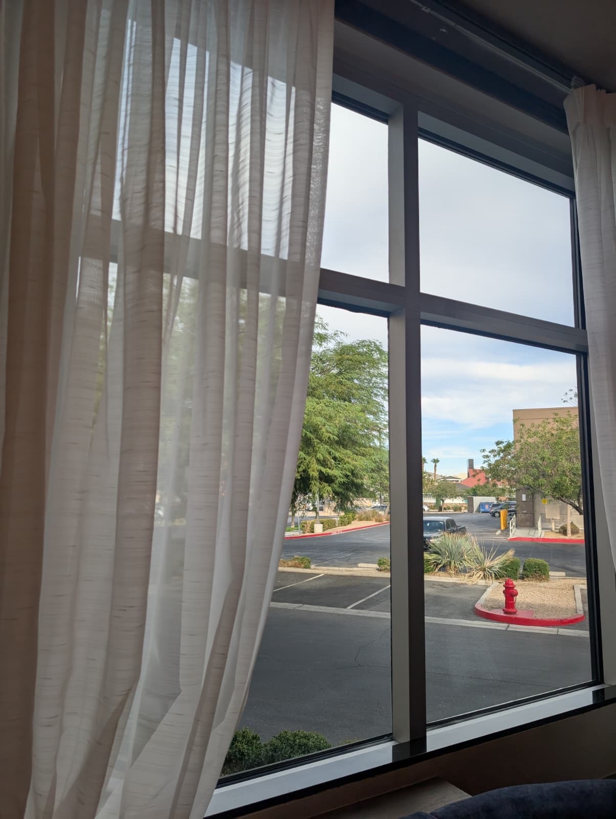 Clear interior window view of a Las Vegas parking lot