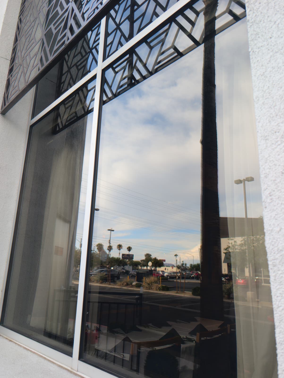 Polished commercial glass under cloudy skies
